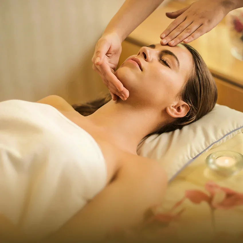 A gentle spa massage beside a bowl of oil